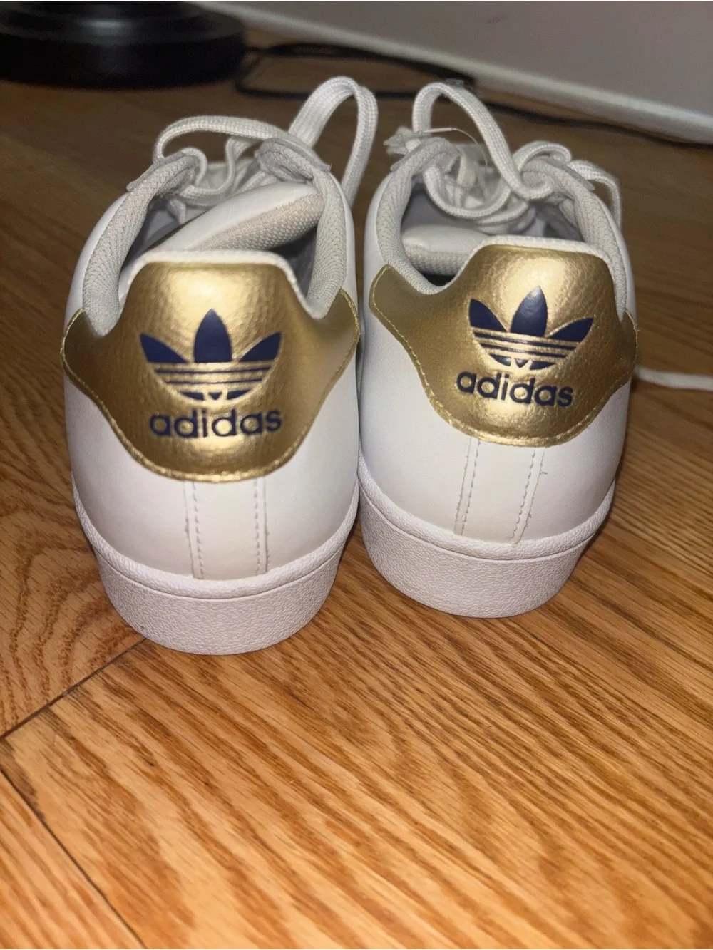 adidas Women's White Sneakers with Gold Stripe Accents